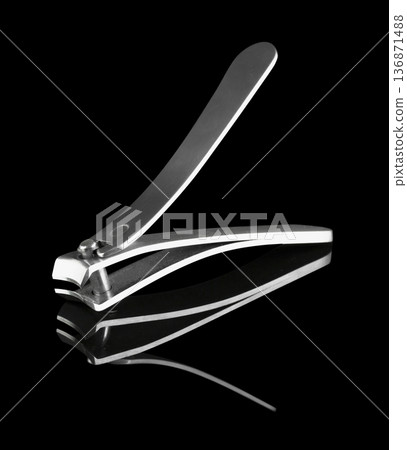 Nail clippers, clippers, manicure hand tools, on black background isolated with reflection 136871488