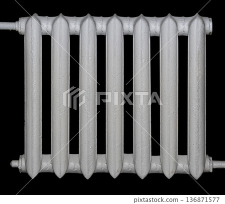 cast iron battery for heating, isolated on a black background cast iron battery for heating, isolated on a black background 136871577