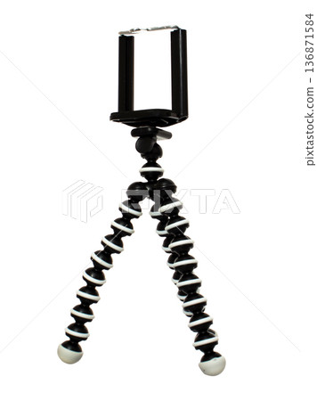 A tripod for a phone, with a mount for a phone, isolated on a white background 136871584