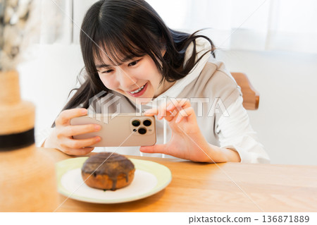 Young woman taking glorious photos Young woman taking glorious photos 136871889