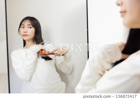 Women's hair care brushing 136872417