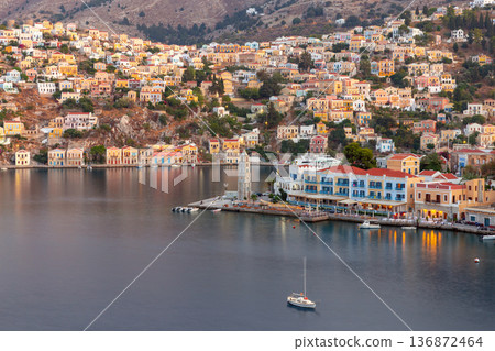 Symi Island Harbor At Sunset With Pastel Houses Greece 136872464
