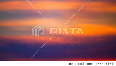 Mysterious clouds and a sky with an orange gradient 136873161