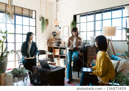 A woman having a meeting in a stylish house studio A woman having a meeting in a stylish house studio 136873459