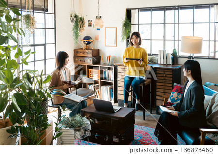 A woman having a meeting in a stylish house studio A woman having a meeting in a stylish house studio 136873460
