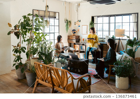 A woman having a meeting in a stylish house studio A woman having a meeting in a stylish house studio 136873461