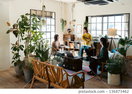 A woman having a meeting in a stylish house studio A woman having a meeting in a stylish house studio 136873462
