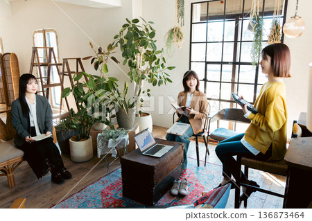 A woman having a meeting in a stylish house studio 136873464