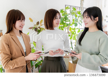 Three women using smartphones Three women using smartphones 136873890