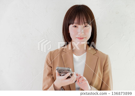 Business woman searching on smartphone Business woman searching on smartphone 136873899