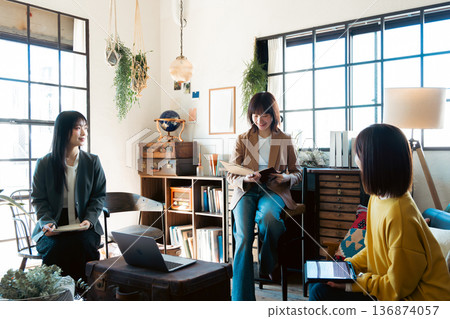 A woman having a meeting in a stylish house studio A woman having a meeting in a stylish house studio 136874057