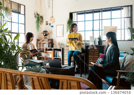 A woman having a meeting in a stylish house studio A woman having a meeting in a stylish house studio 136874058