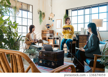 A woman having a meeting in a stylish house studio 136874059