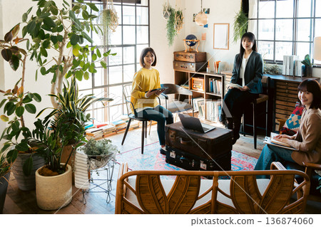 A woman having a meeting in a stylish house studio A woman having a meeting in a stylish house studio 136874060