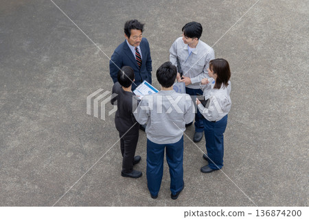 Group photo of company employees standing outside Group photo of company employees standing outside 136874200