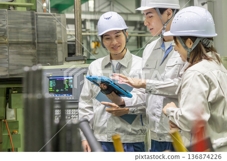 Group of workers working in a factory Group of workers working in a factory 136874226