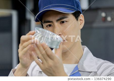 workers working in a factory workers working in a factory 136874290