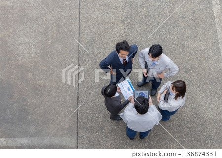 Group photo of company employees standing outside Group photo of company employees standing outside 136874331