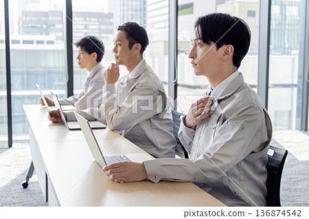 Business person wearing work clothes to receive training Business person wearing work clothes to receive training 136874542