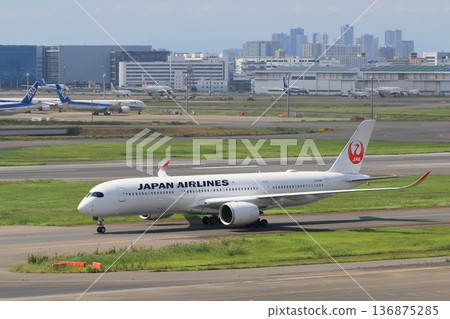 Passenger plane taxiing for takeoff Passenger plane taxiing for takeoff 136875285