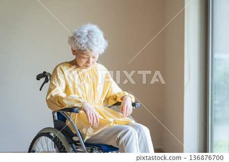 Senior woman in a wheelchair Senior woman in a wheelchair 136876700
