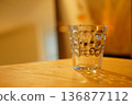 Glass on the table 136877112