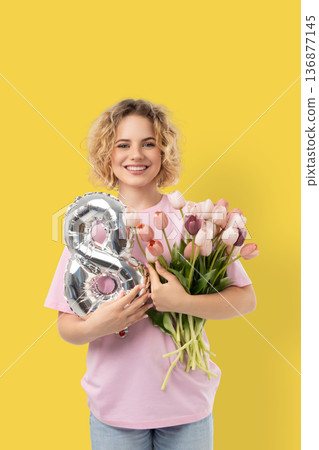 Woman with flowers and an 8 balloon Woman with flowers and an 8 balloon 136877145