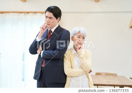 Worried businessman and senior woman 136877335