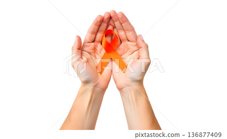 Hands clasping an orange ribbon on a transparent backdrop, highlighting support for leukemia awareness and blood cancer initiatives 136877409