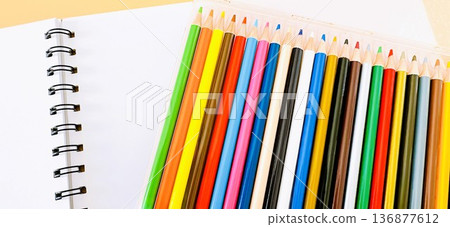Sketchbooks and colored pencils Sketchbooks and colored pencils 136877612