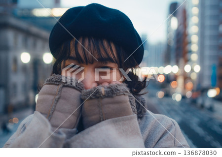 A Japanese woman in her 30s quietly closing her eyes in the city at night A Japanese woman in her 30s quietly closing her eyes in the city at night 136878030