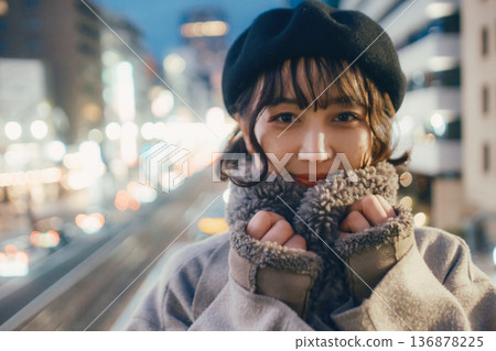 A Japanese woman in her 30s quietly closing her eyes in the city at night A Japanese woman in her 30s quietly closing her eyes in the city at night 136878225