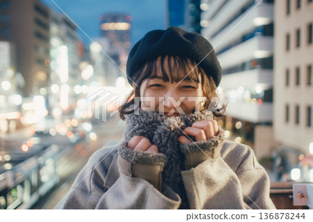 A Japanese woman in her 30s quietly closing her eyes in the city at night A Japanese woman in her 30s quietly closing her eyes in the city at night 136878244