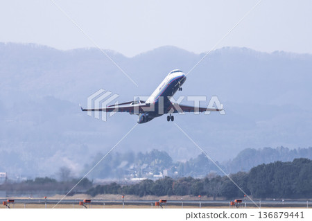Sendai Airport in winter, airplane taking off, Natori City, Miyagi Prefecture 136879441