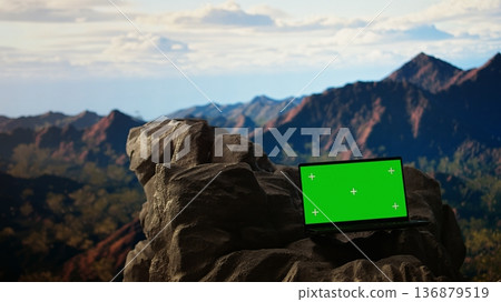 Captivating mountain escape with a rugged rocky and chroma key in the foreground. This natural beauty spot is ideal for travelers looking to experience an unforgettable wilderness adventure. Captivating mountain escape with a rugged rocky and chroma key in the foreground. This natural beauty spot is ideal for travelers looking to experience an unforgettable wilderness adventure. 136879519
