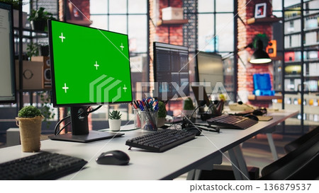 Isolated screen computer displays in customer support workplace, panning shot. Chroma key PC monitors in empty call center office where unsatisfied customers call to solve technical problems 136879537