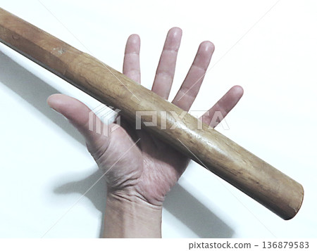 Hand holding a sword Hand holding a sword 136879583
