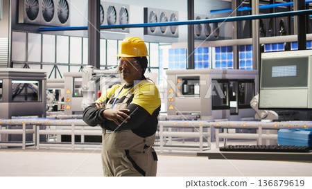 Woman conducts routine inspections in industry 4.0 solar panels plant producing renewable energy. Engineer in photovoltaics smart factory testing equipment and reviewing system metrics Woman conducts routine inspections in industry 4.0 solar panels plant producing renewable energy. Engineer in photovoltaics smart factory testing equipment and reviewing system metrics 136879619