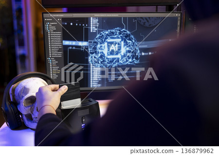 Hacker using hard drive with sensitive information obtained by running neural network software to breach company locked databases. Man uploading stolen data on SSD after finishing cyber attacks Hacker using hard drive with sensitive information obtained by running neural network software to breach company locked databases. Man uploading stolen data on SSD after finishing cyber attacks 136879962