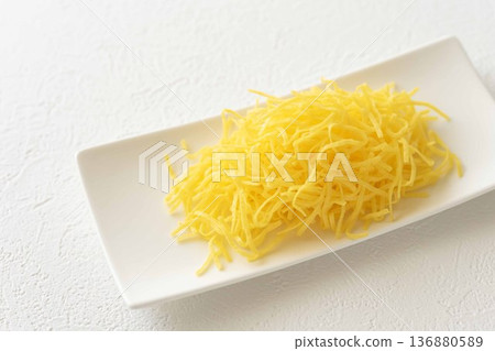 Thinly sliced egg served on a long white plate Thinly sliced egg served on a long white plate 136880589