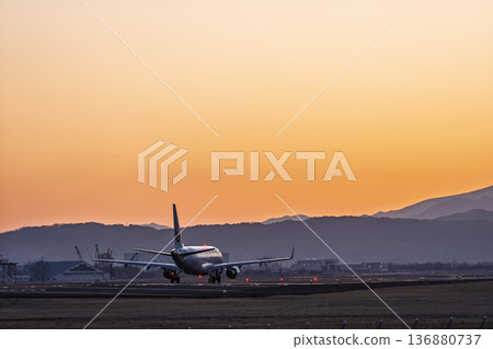 Sendai Airport at dusk: Sunset and planes taking off, Natori City, Miyagi Prefecture 136880737
