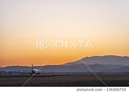 Sendai Airport at dusk: Sunset and planes taking off, Natori City, Miyagi Prefecture 136880738