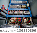 Voltage switchboard with circuit breakers. Electrical background. 136880896
