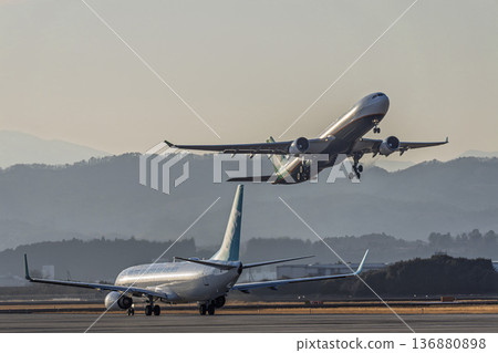 Sendai Airport at dusk, airplane taking off, Natori City, Miyagi Prefecture 136880898