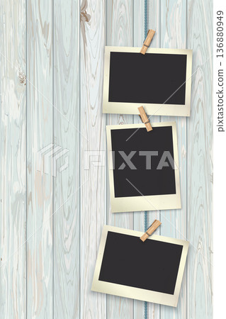 Old blank photograph papers hanging vertically on the rope by clothespins with wooden tropical style background. Old blank photograph papers hanging vertically on the rope by clothespins with wooden tropical style background. 136880949