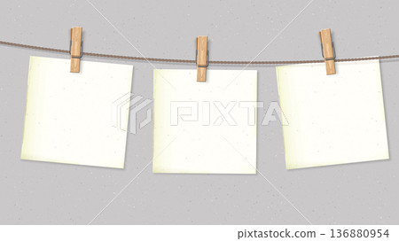 Old blank square notepapers hanging on the rope by wooden clothespins with cement wall background Old blank square notepapers hanging on the rope by wooden clothespins with cement wall background 136880954