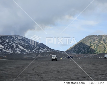this is Bromo mountain with people and car this is Bromo mountain with people and car 136881454