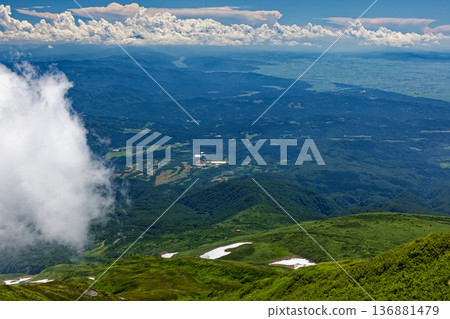 The Shinjiyuki snowfield and Shonai Plain seen from the outer rim of Mt. Chokai The Shinjiyuki snowfield and Shonai Plain seen from the outer rim of Mt. Chokai 136881479