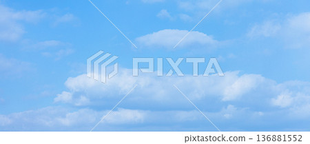 A simple landscape with pale blue sky and white clouds A simple landscape with pale blue sky and white clouds 136881552