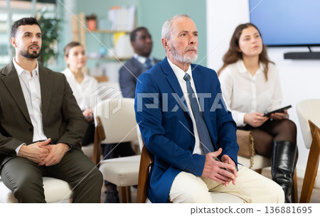 Group of businessmen at an international conference 136881695